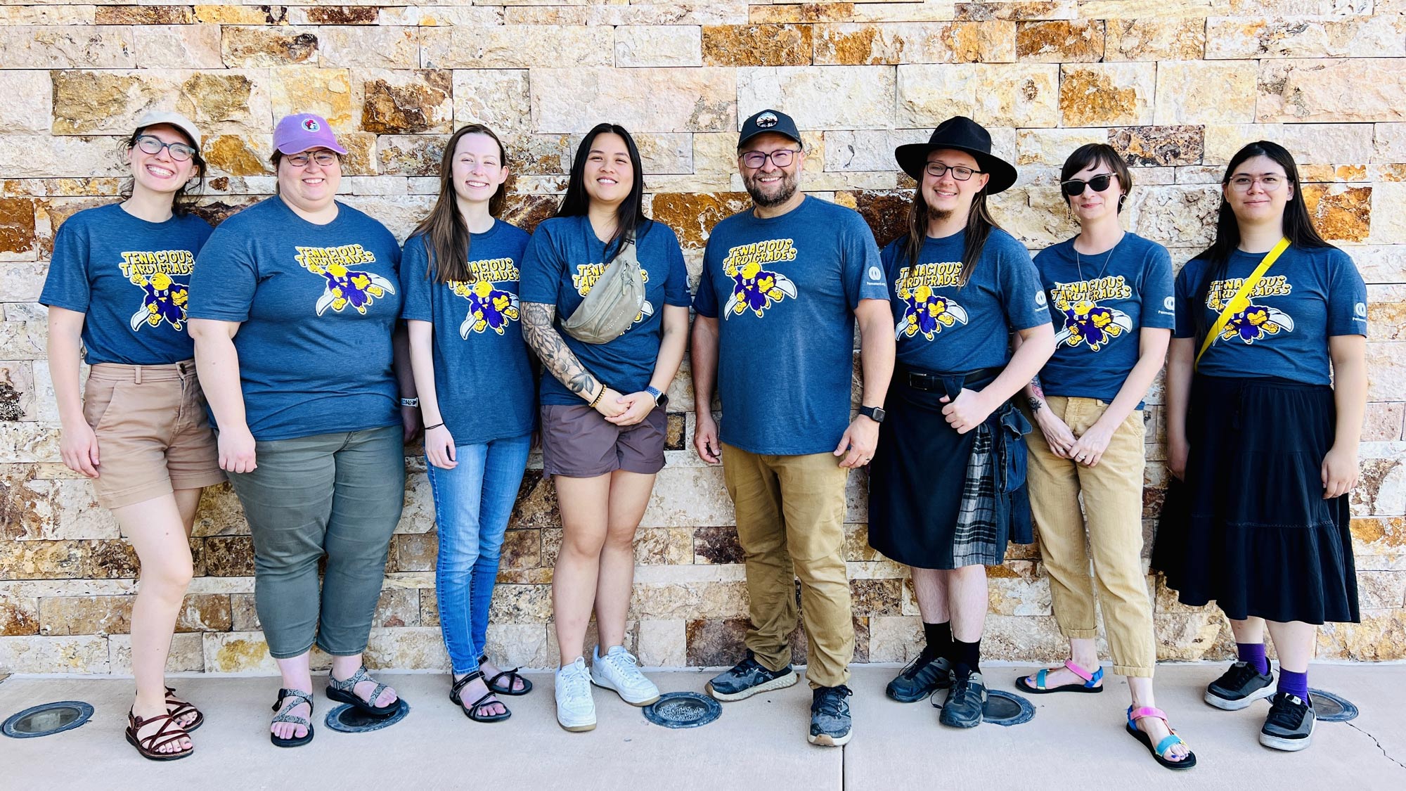 Group photo of Permanent team with matching Tenacious Tardigrades t-shirts